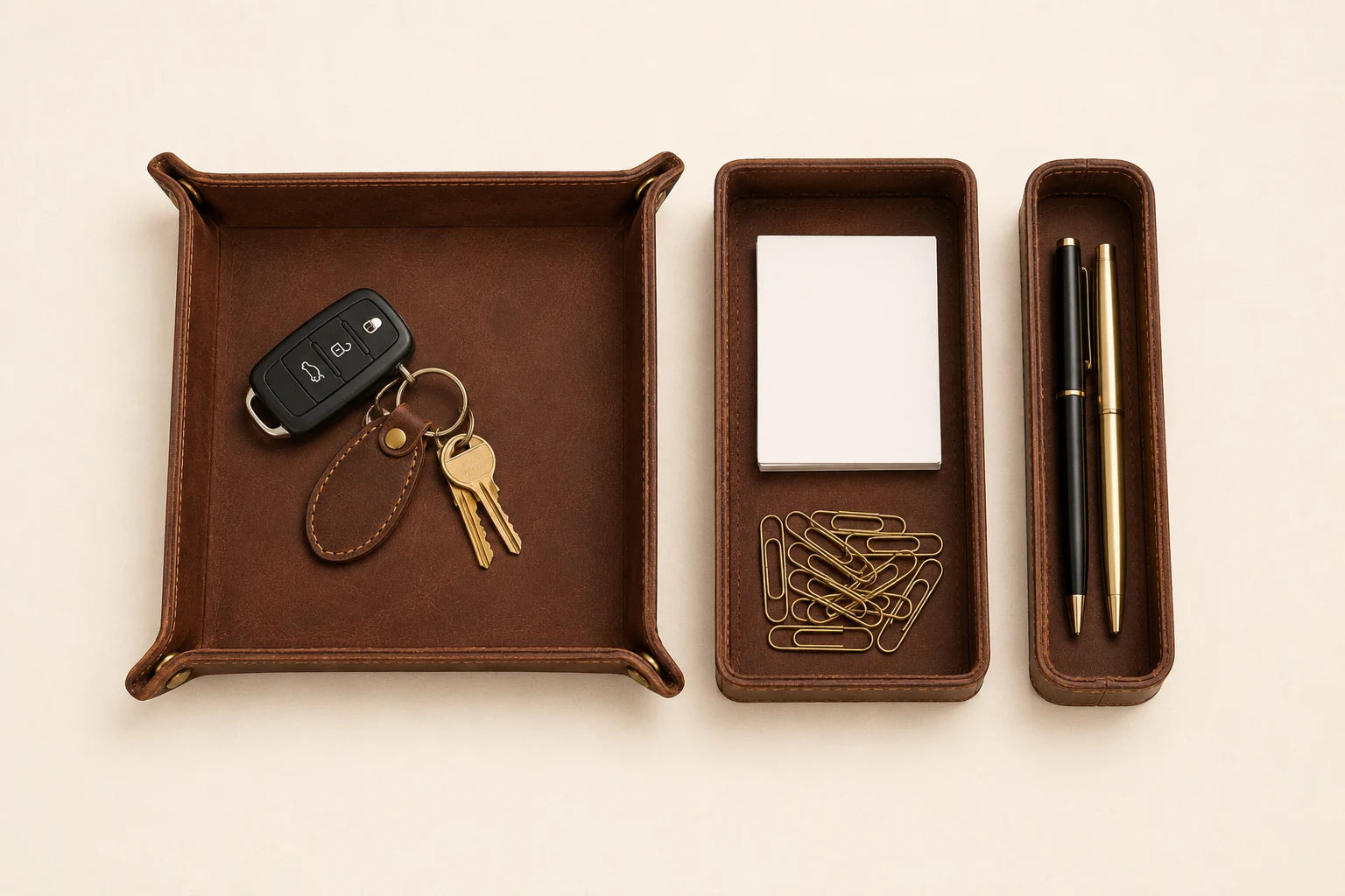 Top-down view of leather valet tray pen tray and small desk organizer pieces