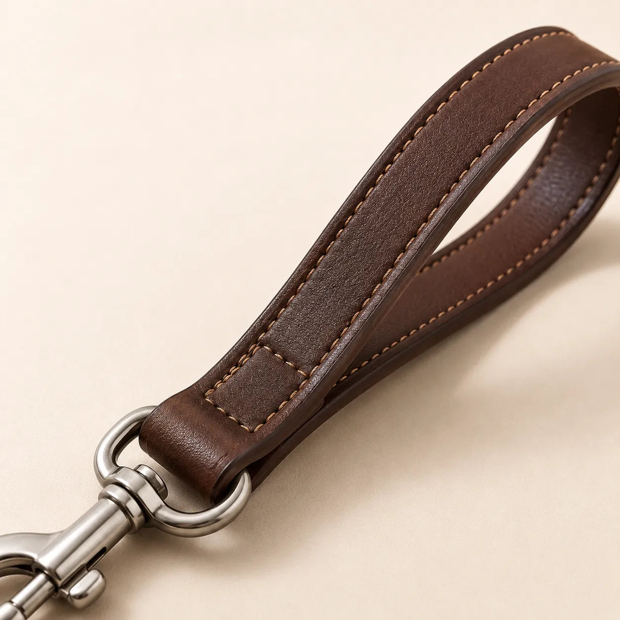 Close-up of leather leash handle stitching and polished edges
