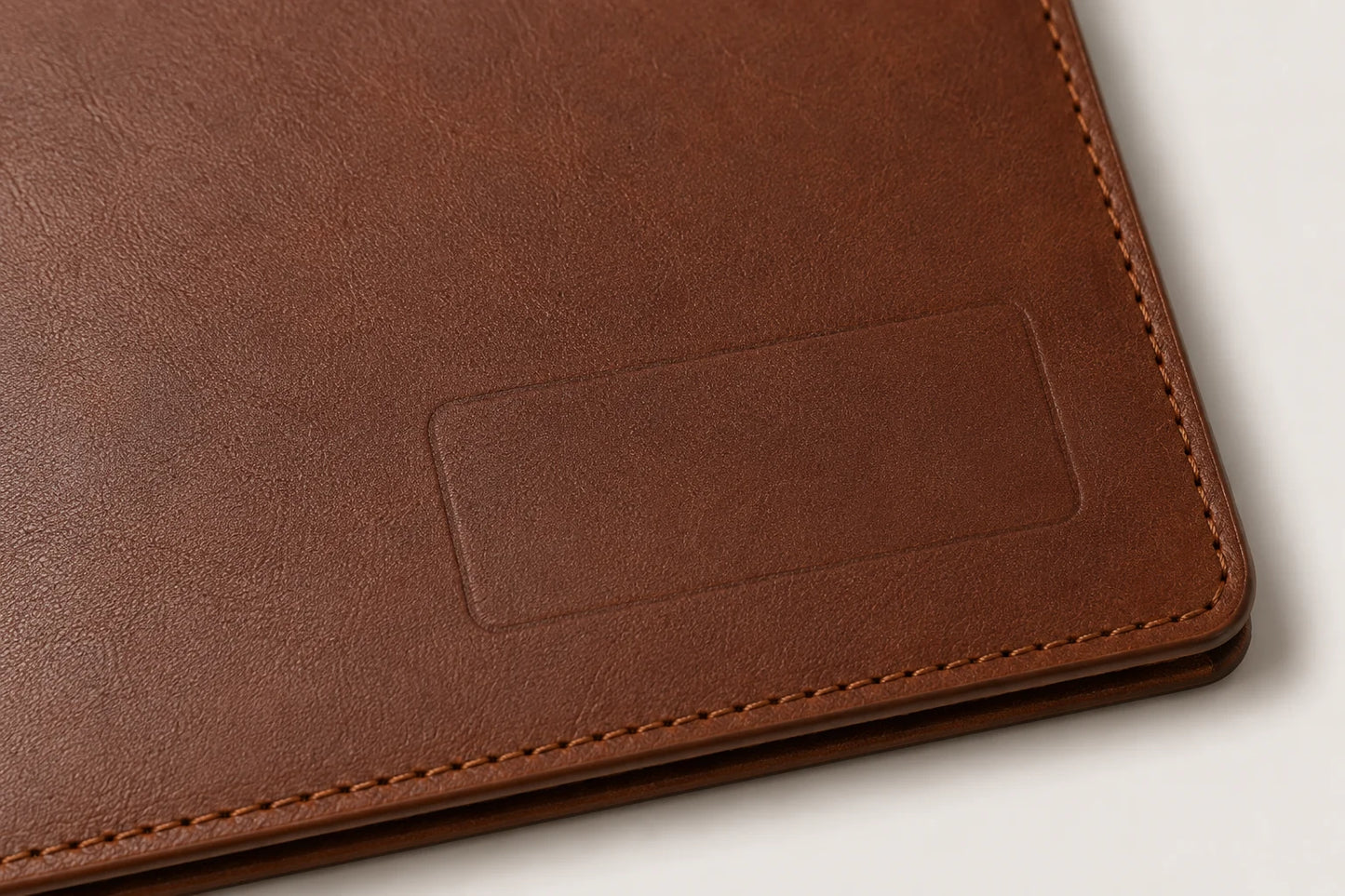 Close-up of leather notebook folder interior sleeve and stitched edge