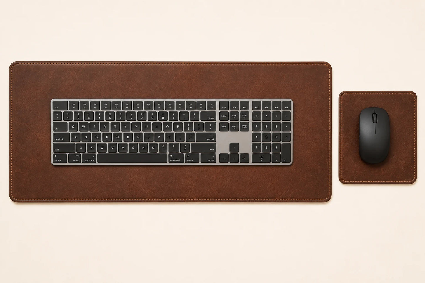 Top-down view of matching leather keyboard mat and mouse pad with generic keyboard and mouse