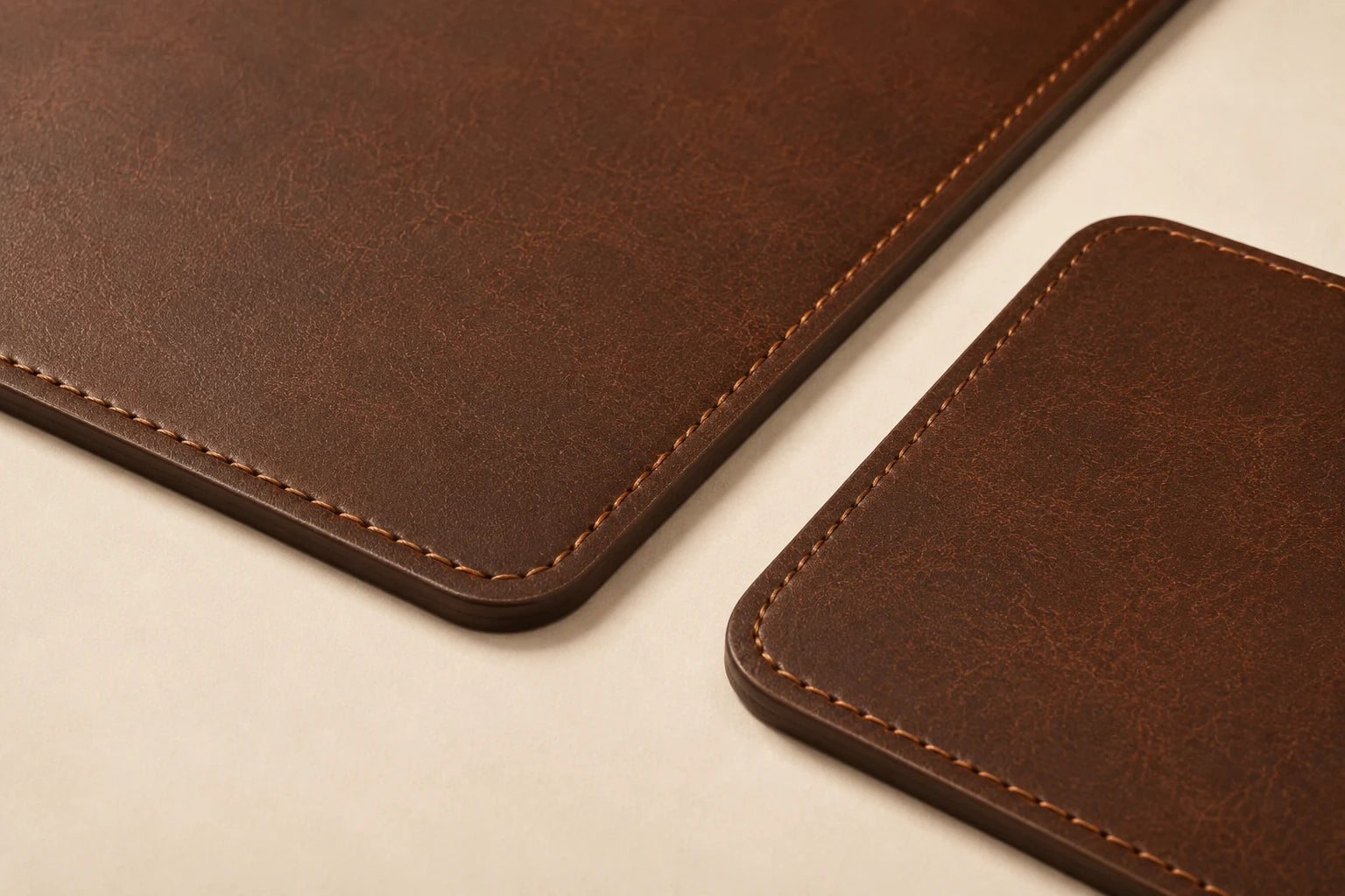 Close-up of stitched border and leather grain on mouse pad and keyboard mat set