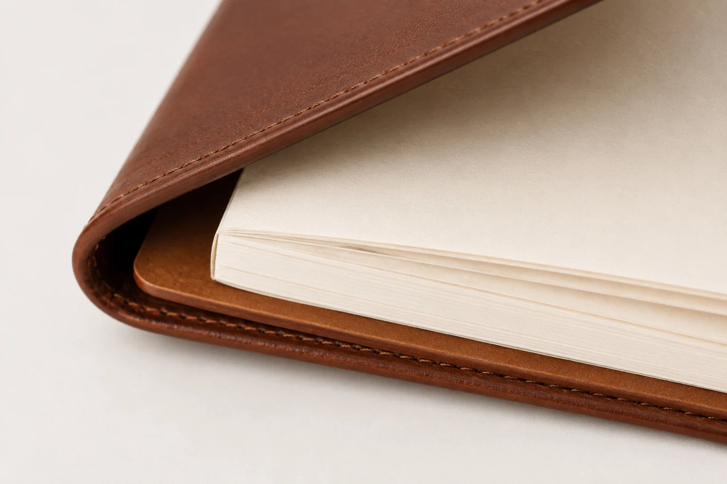 Close-up of leather menu notebook cover paper insert and folded edge