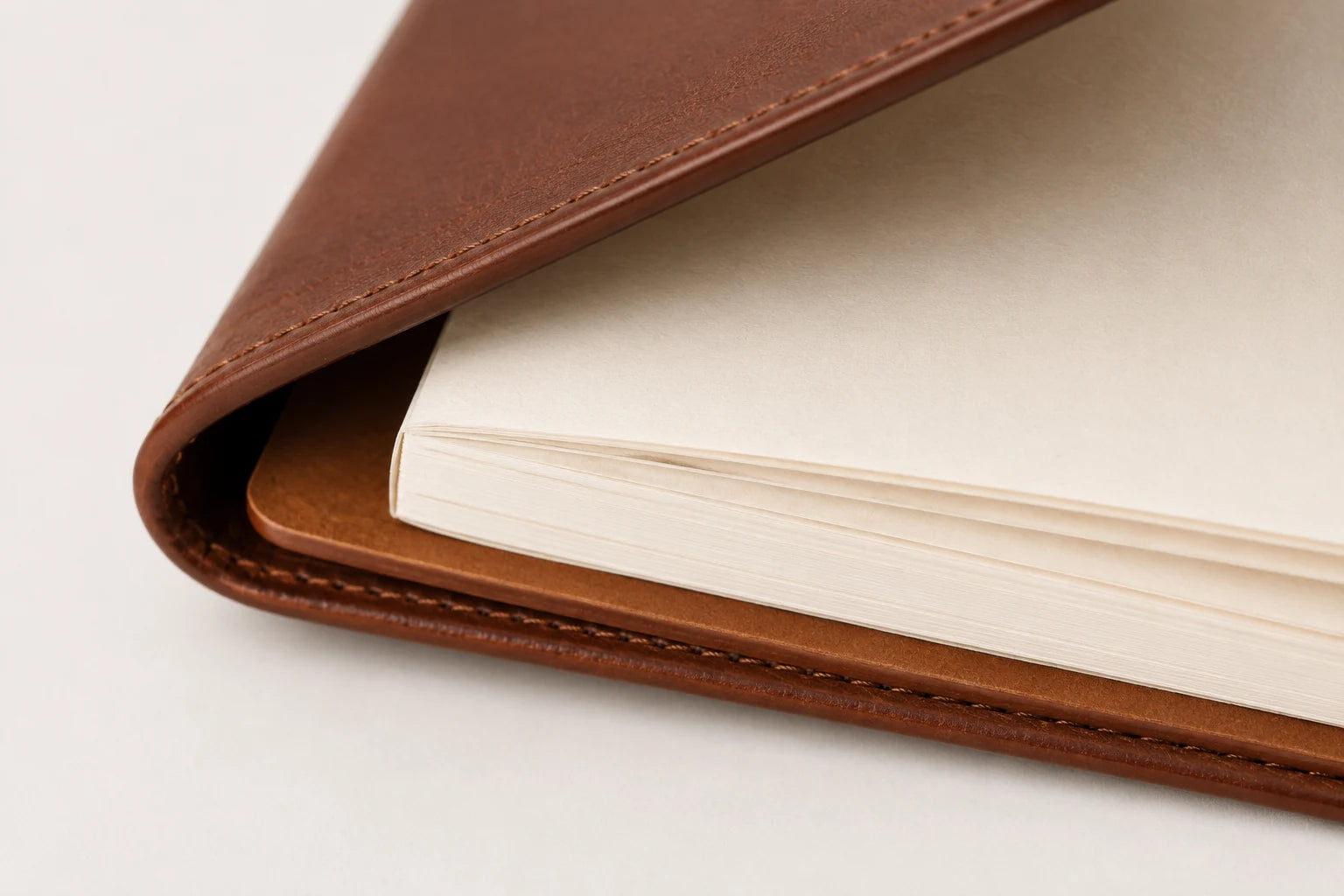 Close-up of leather menu notebook cover paper insert and folded edge