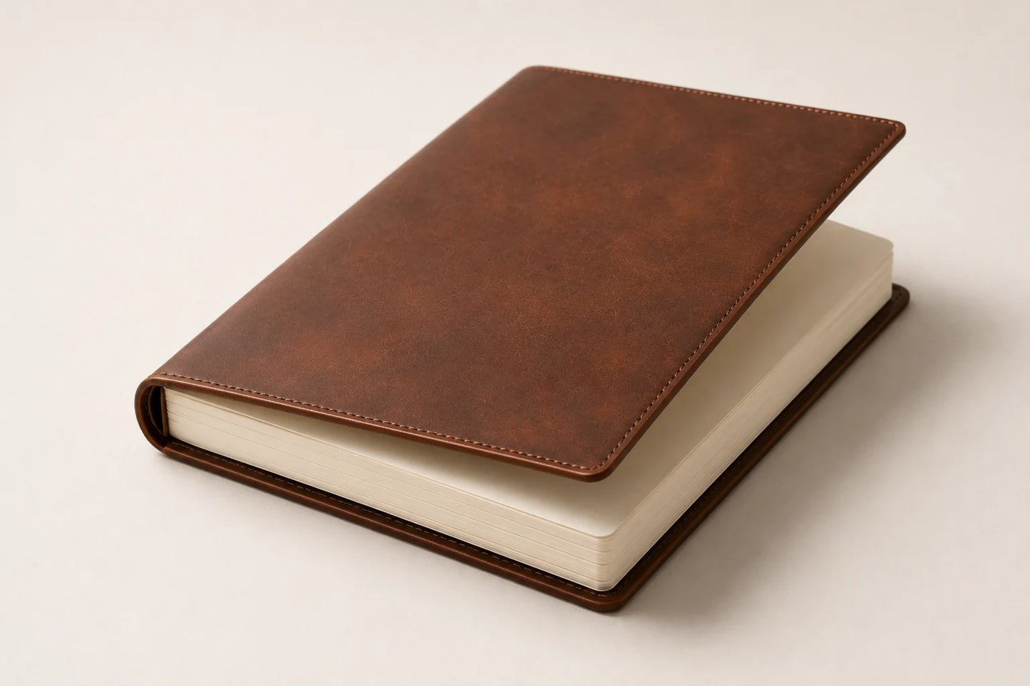Angled leather sketchbook cover with thick blank drawing paper insert