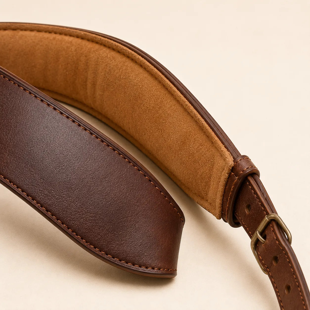 Close-up of padded shoulder section on leather guitar strap