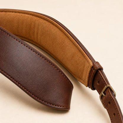 Close-up of padded shoulder section on leather guitar strap