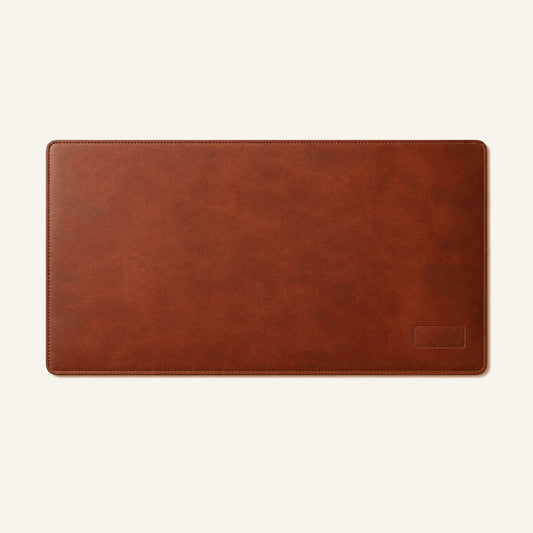 Top-down view of personalized leather desk mat with stitched border and rounded corners