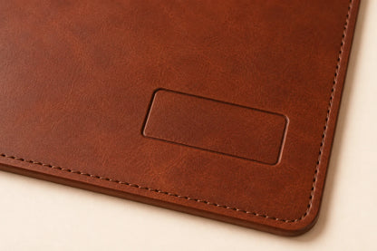 Close-up of blank logo area and leather grain on personalized desk mat