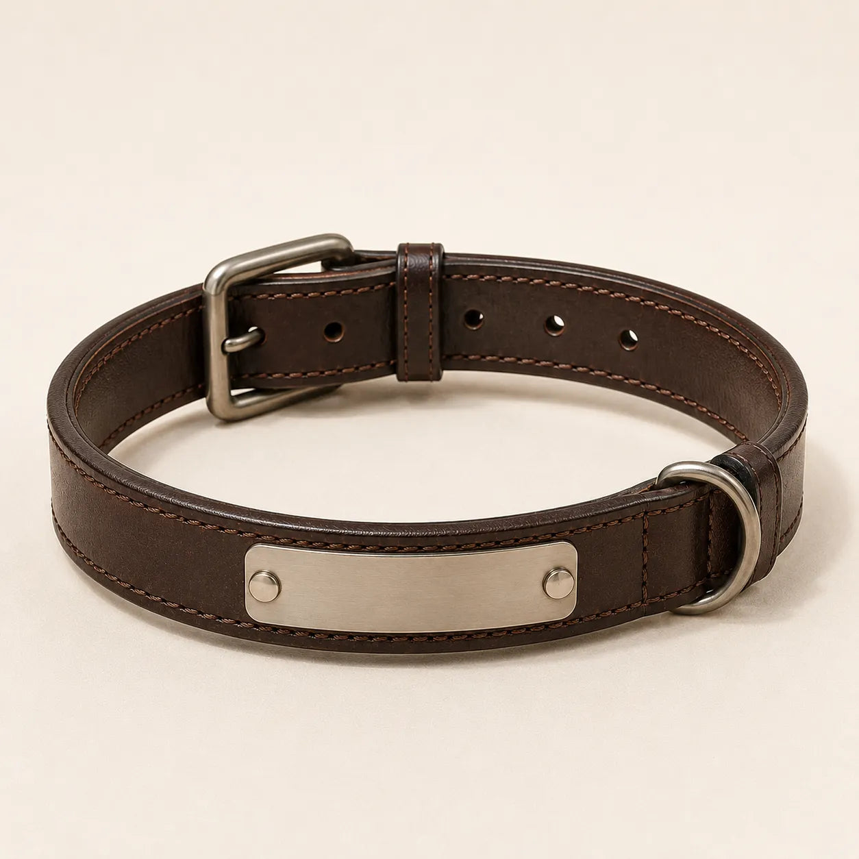 Angled view of personalized leather dog collar with metal nameplate