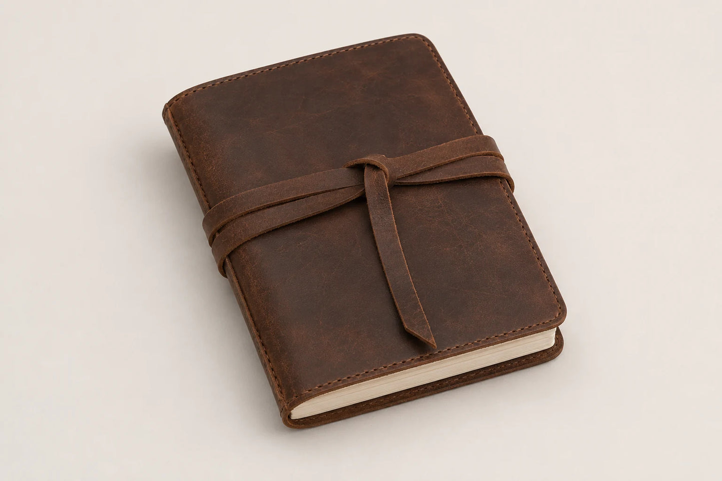 Refillable brown leather travel journal with wrap strap for wholesale OEM customization