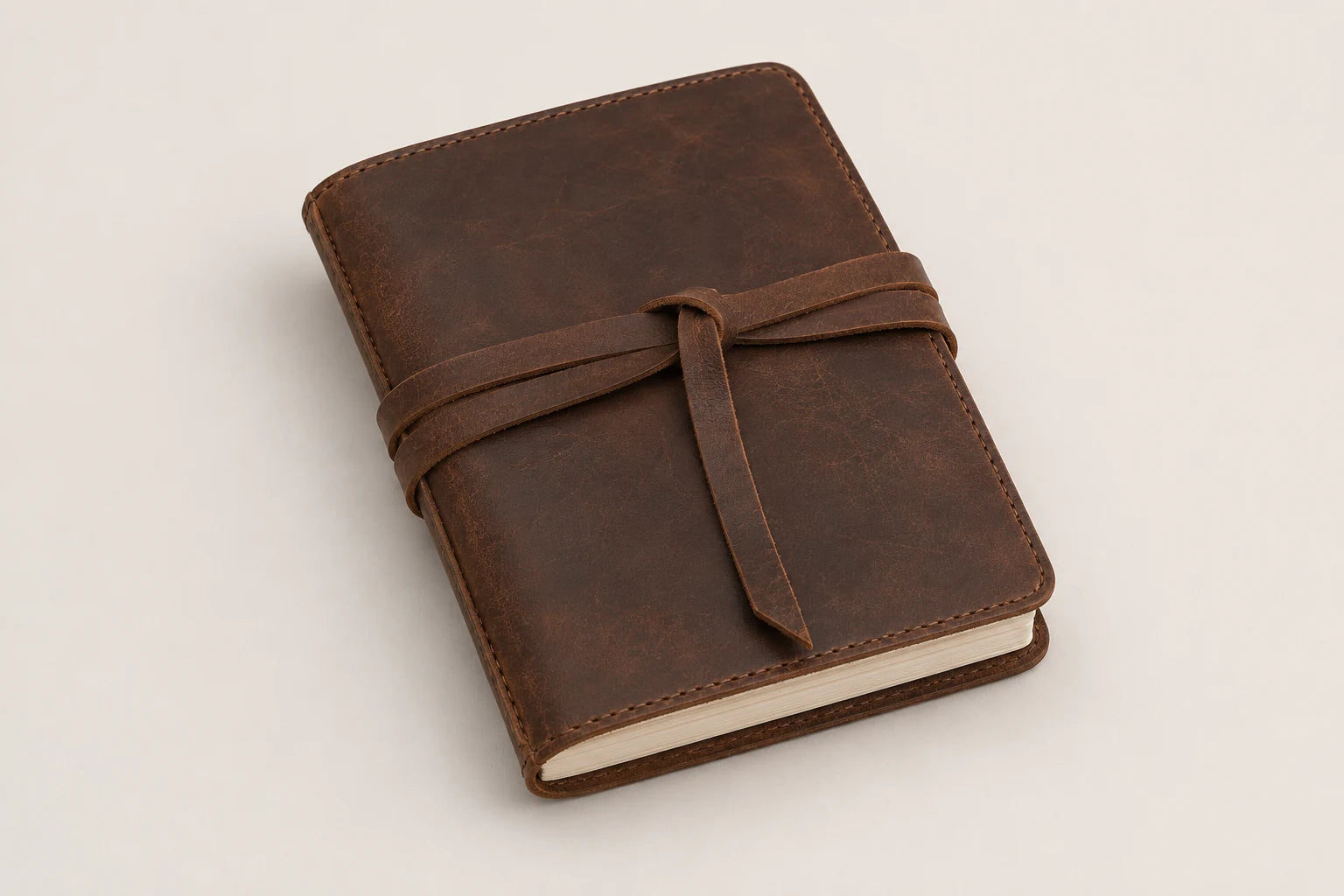 Refillable brown leather travel journal with wrap strap for wholesale OEM customization