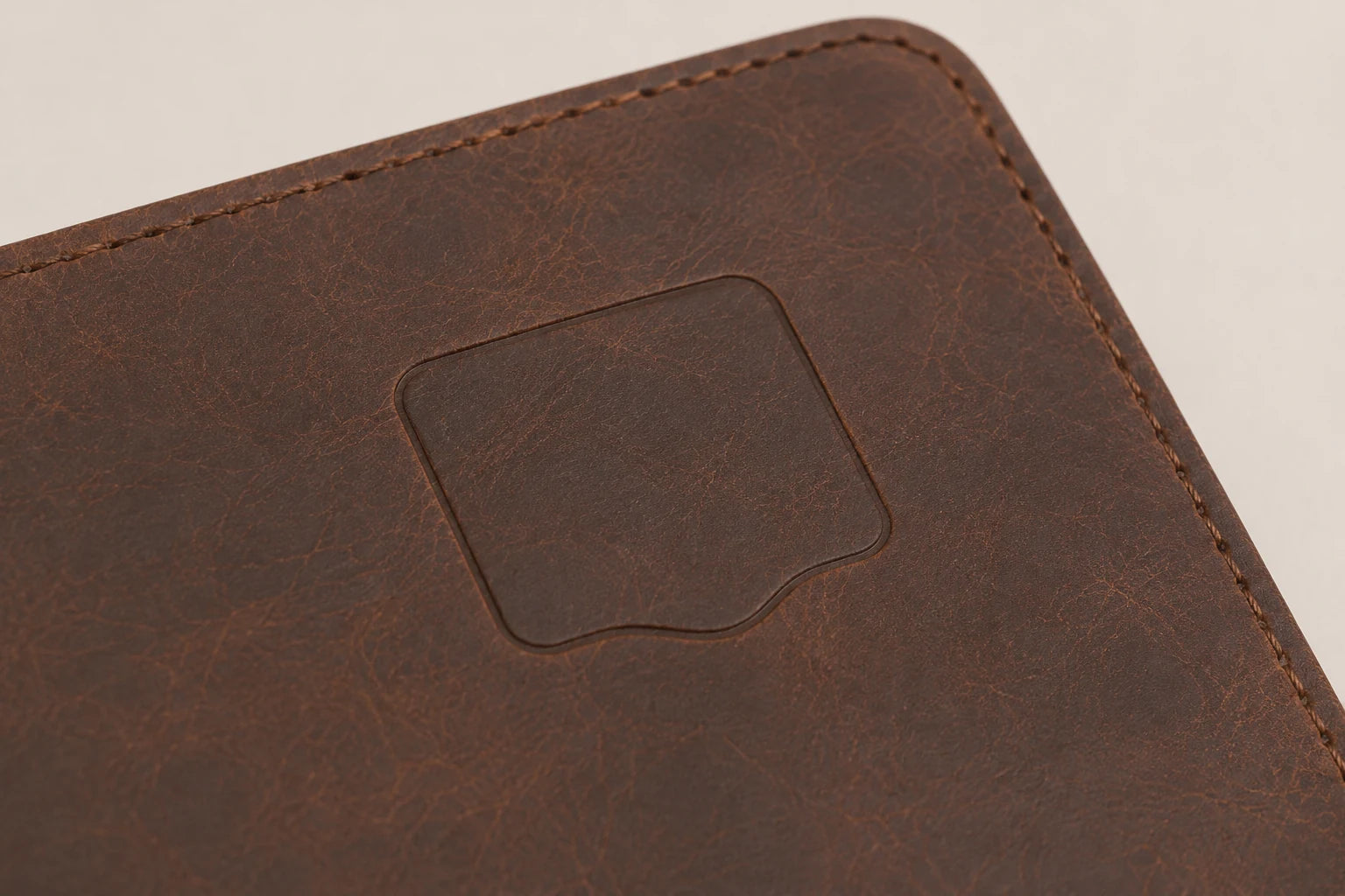 Blank debossing area on brown leather travel journal cover