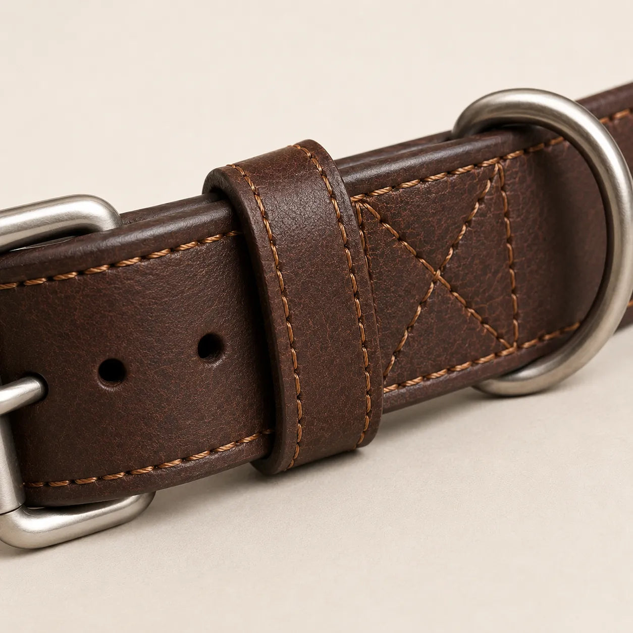 Close-up of reinforced stitching and wide leather strap on dog collar
