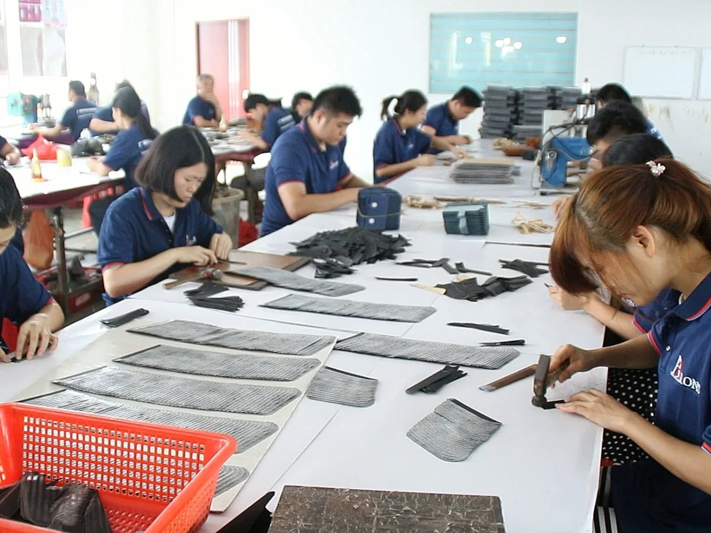 Aarons Leather production team preparing a custom leather goods order